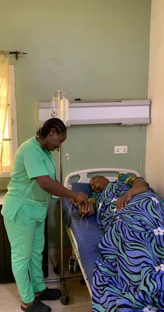 Nurse attending to a patient in the maternity ward